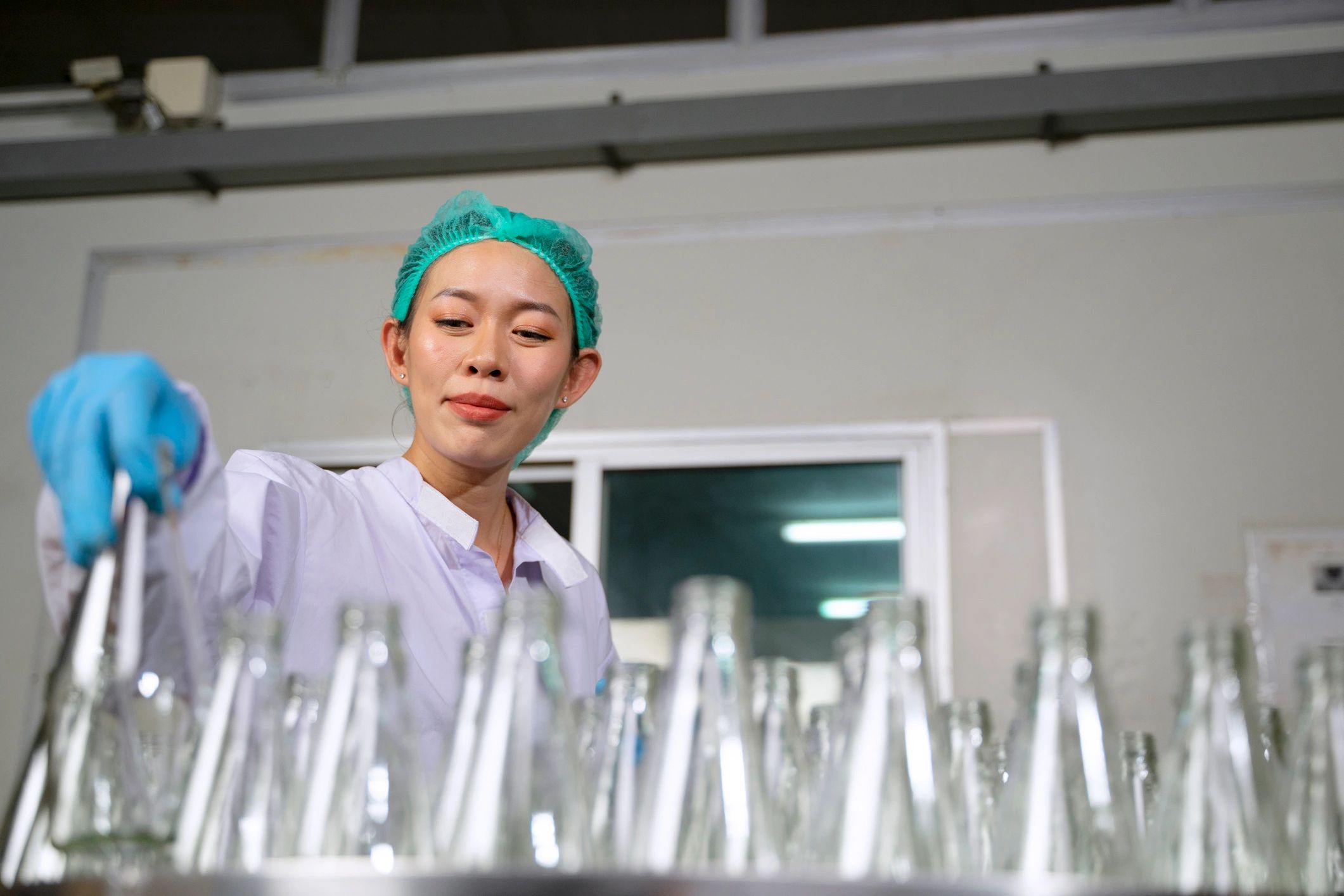 Quality control technician monitoring a production line