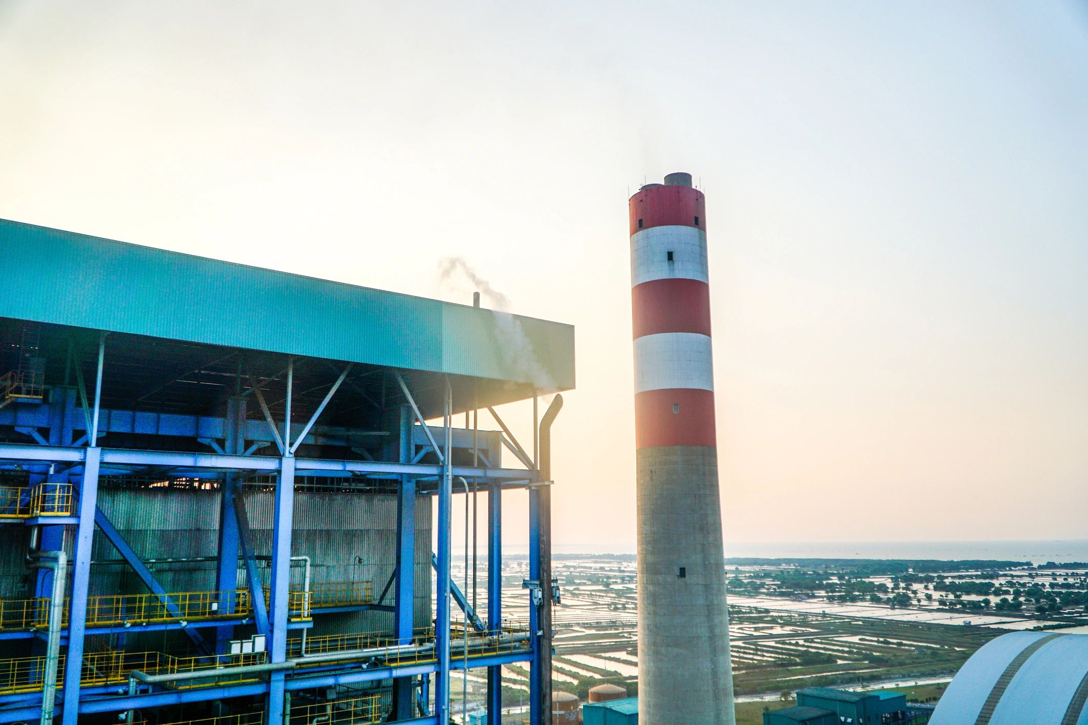 Industrial plant exterior at sunset